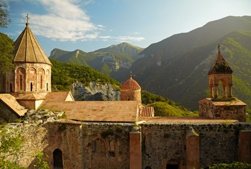 Ancient Armenian stone monastery in the Dilijan forest, featured on an expert-guided Caucasus tour.