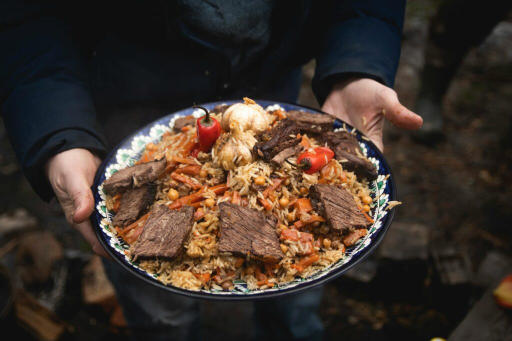 Uzbekistan Cuisine close up of holding delicious food on a plate