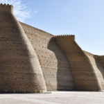 Architectural detail of the historic Ark Fortress walls in Bukhara, Uzbekistan