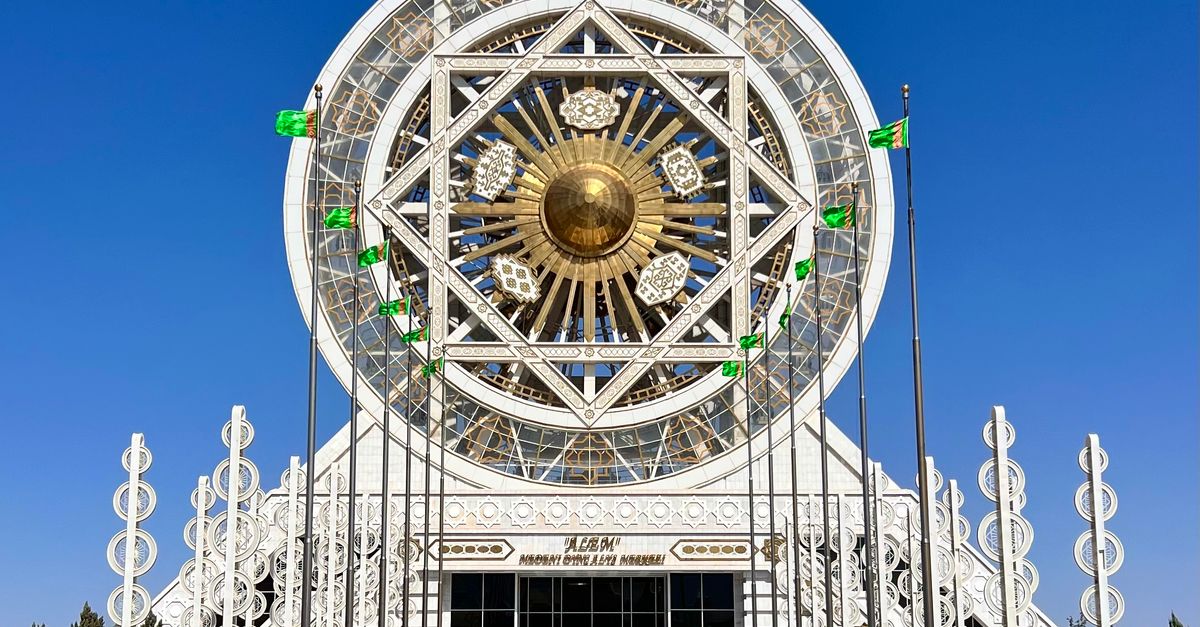 The Ashgabat Ferris Wheel against a clear blue sky in Turkmenistan