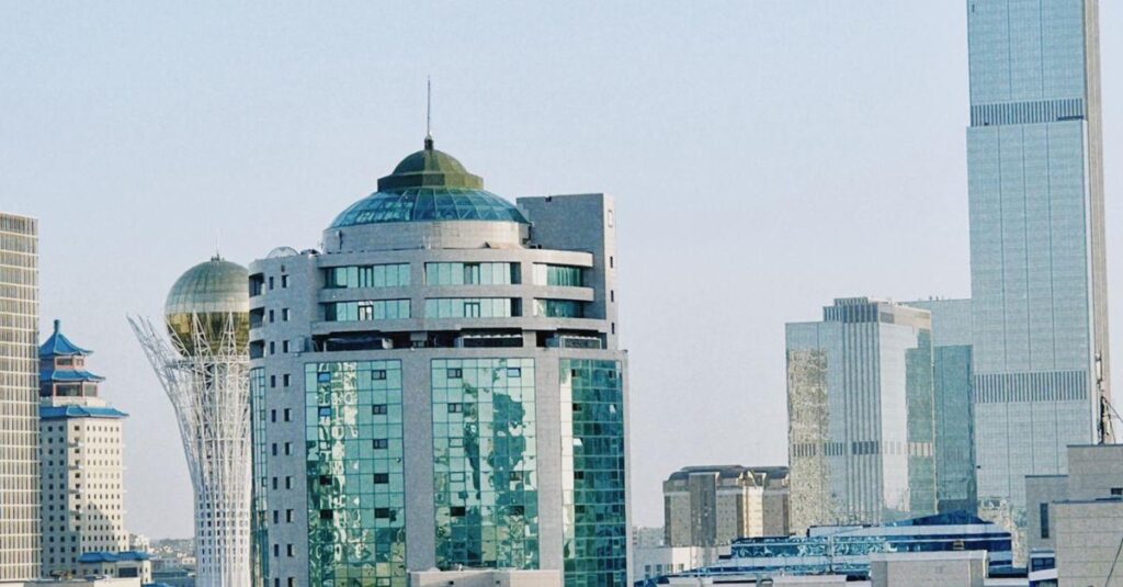 Astana skyline featuring modern architecture and iconic tower under a clear blue sky