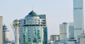Astana skyline featuring modern architecture and iconic tower under a clear blue sky