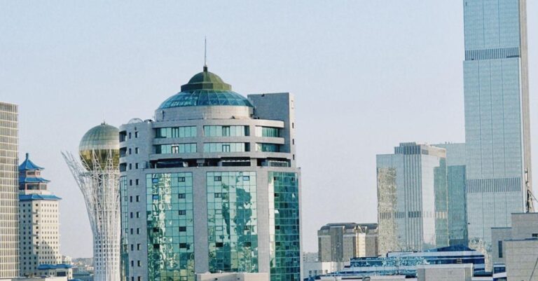 Astana skyline featuring modern architecture and iconic tower under a clear blue sky