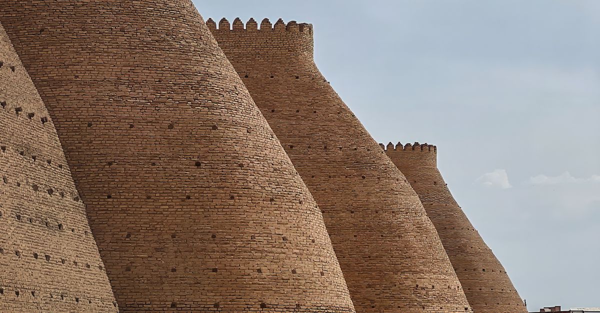 Majestic brick walls of the historic Ark Fortress in Bukhara, Uzbekistan