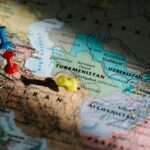 Pushpins marking destinations on a detailed map of Central Asia