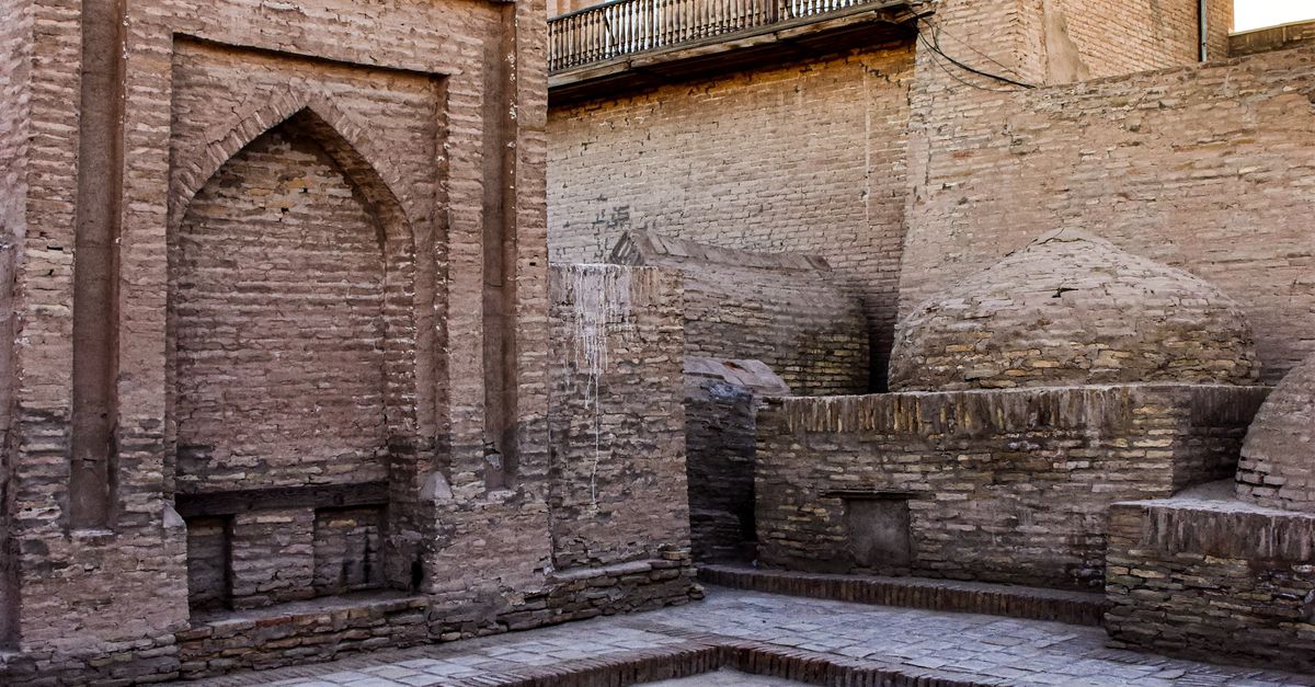 Ancient architecture and courtyard with intricate brickwork in Khiva's old town