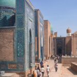 People walking through the vibrant Shah-i-Zinda necropolis in Samarkand