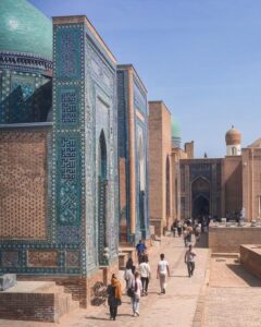 People walking through the vibrant Shah-i-Zinda necropolis in Samarkand