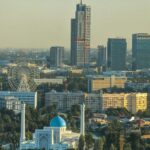 Aerial daytime view of Tashkent skyline featuring modern buildings and historic architecture
