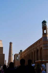 Historic minarets in the walled city of Khiva, Uzbekistan under a clear sky