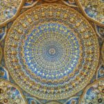 Stunning ceiling inside the Tilya-Kori Madrasa in Samarkand showing intricate patterns